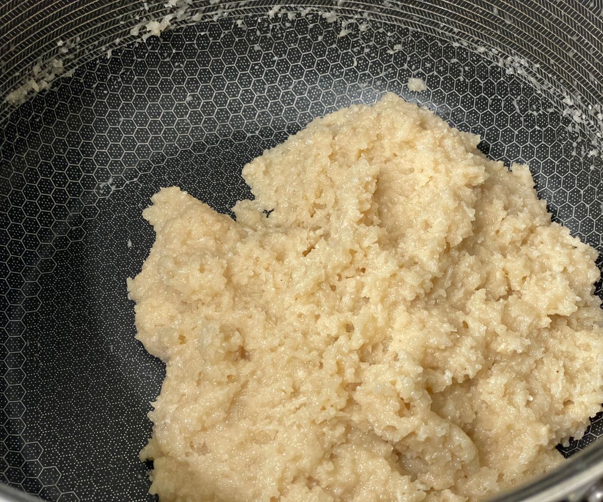 A pan has coconut barfi sweet.