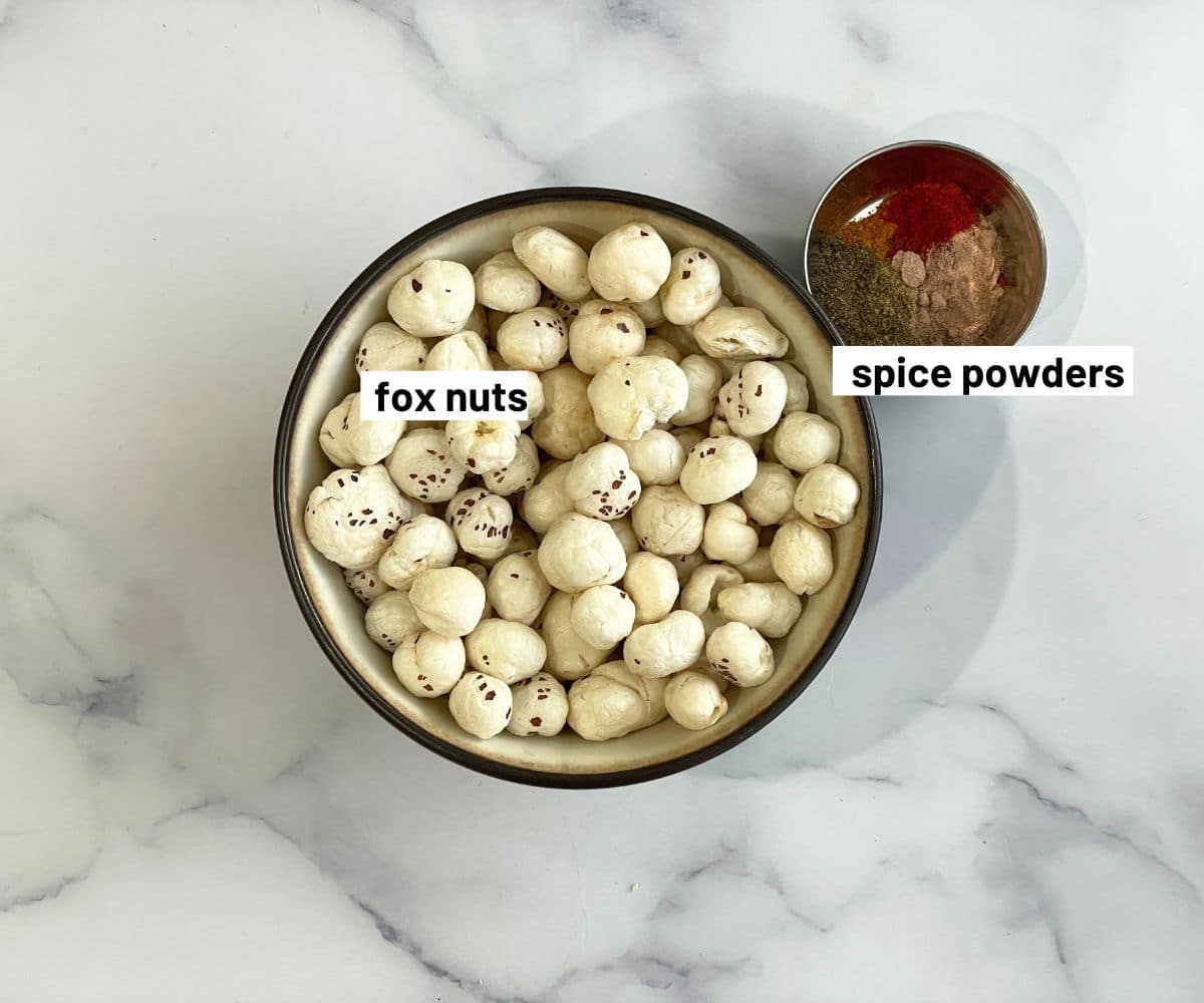 Bowl of lotus seeds and spices for the roasted makhana.