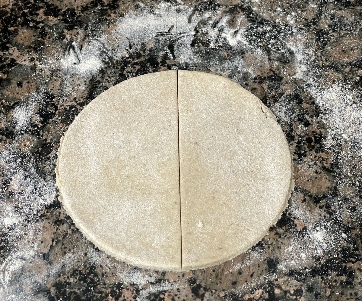 A round shaped samosa dough is divided.