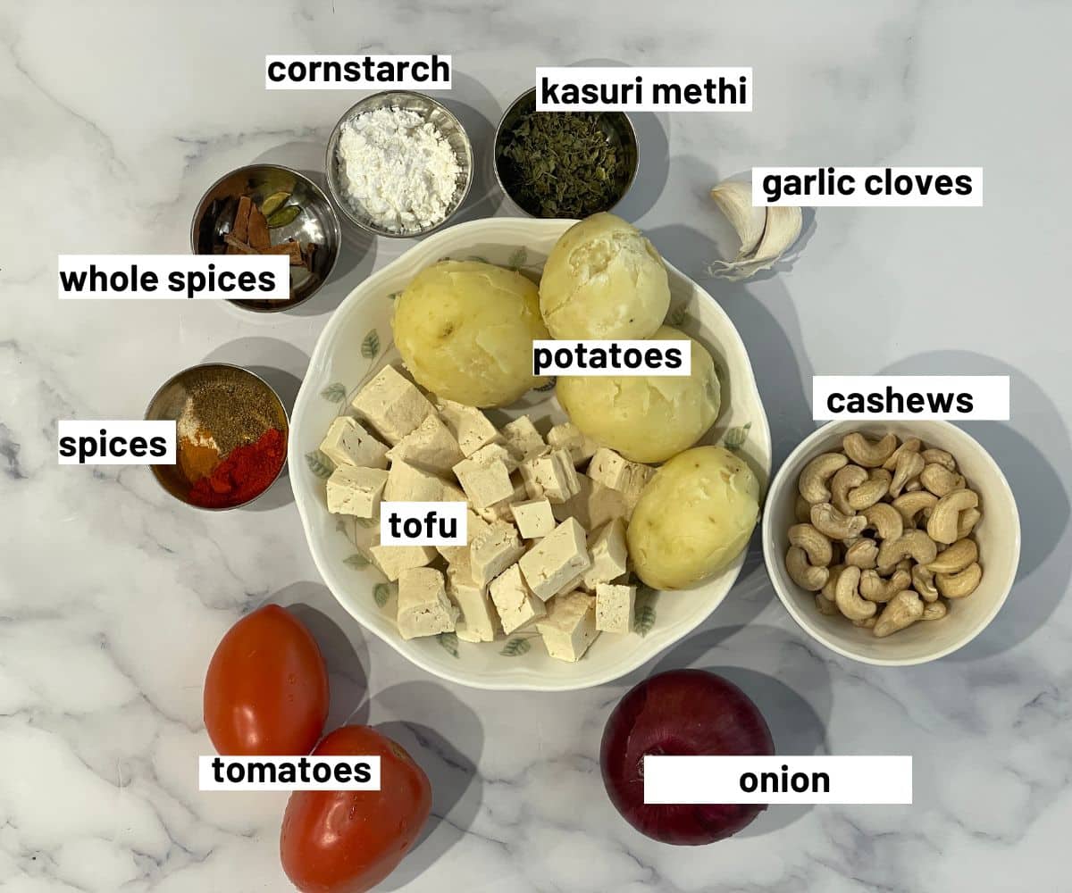 Malai kofta curry ingredients are on the surface.