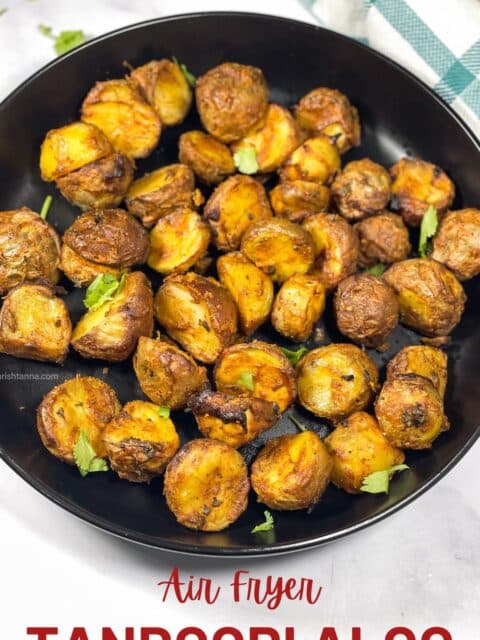 A plate full of air fried tandoori aloo.