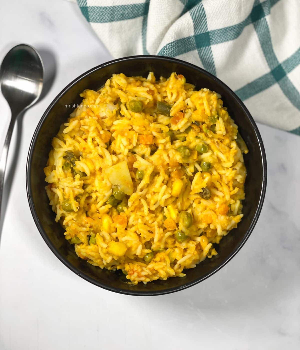 A bowl full of Bengali mung dal khichdi.