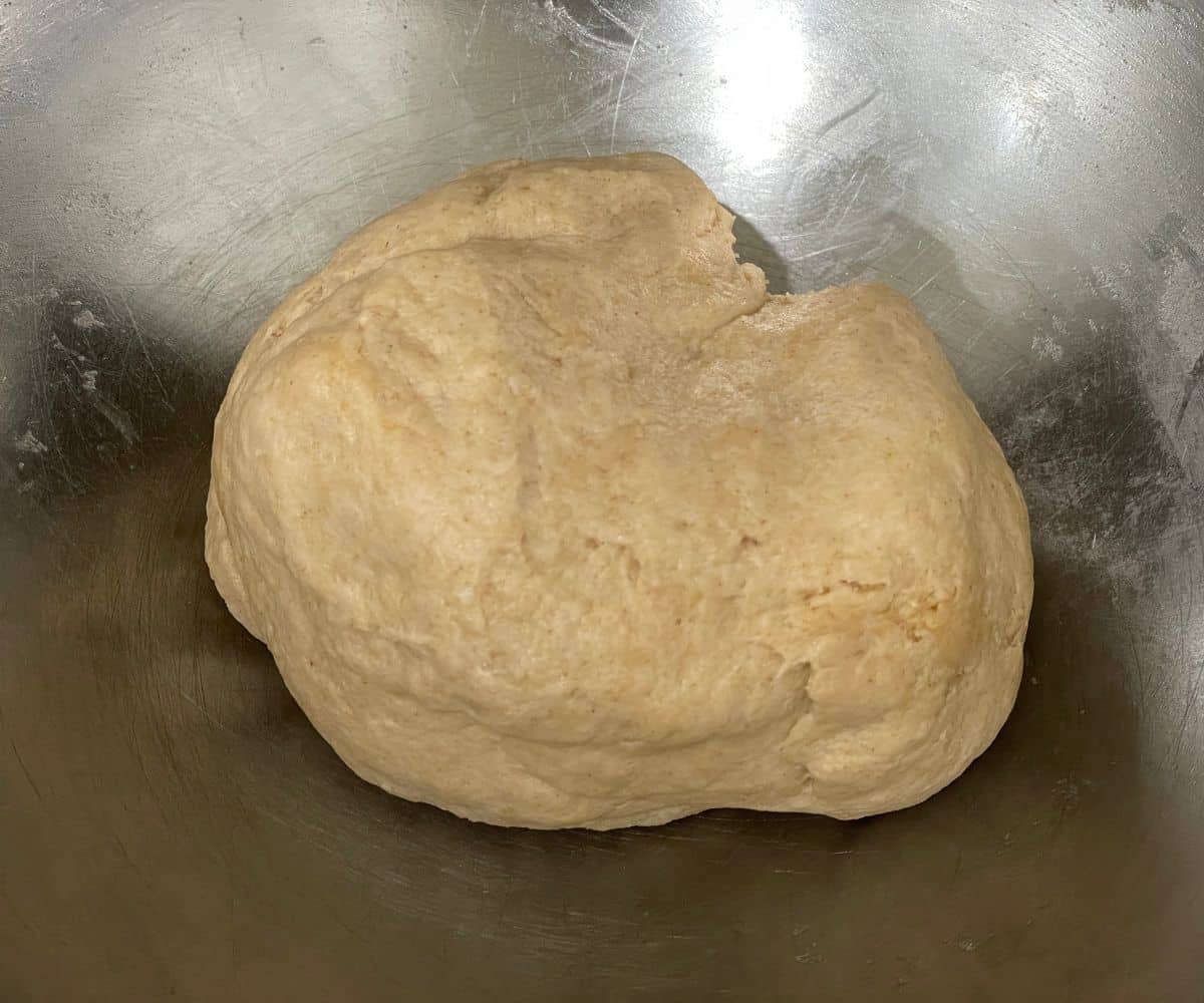 A bowl has chapati dough.