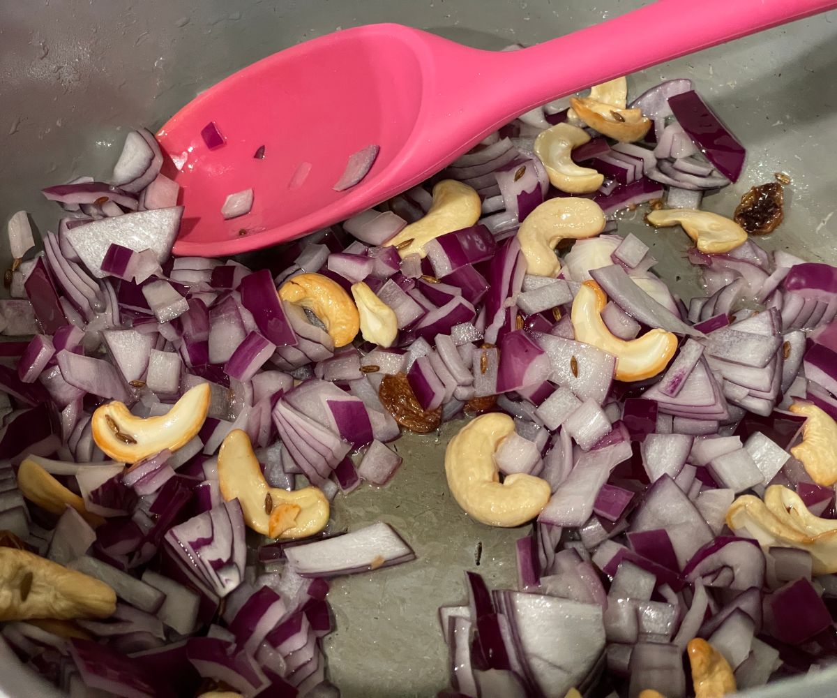 A pot has chopped onions with other spices.