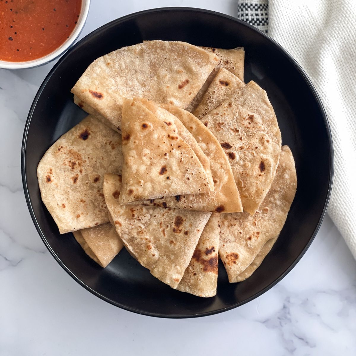 Image of Making Roti (Indian Chapati) On Roti Tawa Made Of Wheat