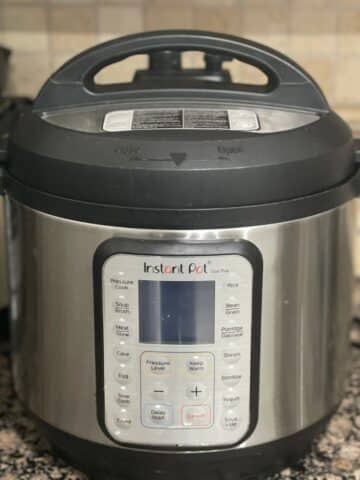Instant pot pressure cooker is on the counter top.