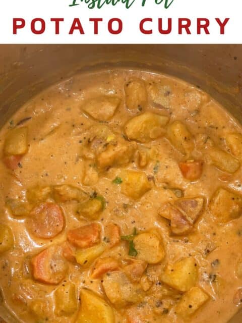 A pot of vegan potato curry is on the table.