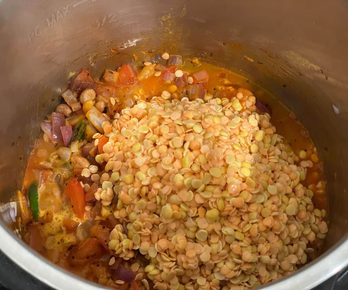 An instant pot has lentils and spices for dal.