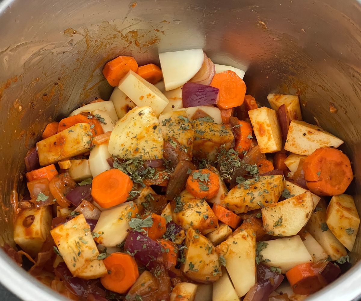 Instant pot has vegan potato curry ingredients to cook.