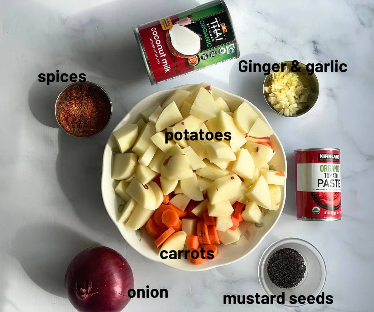 Potato curry ingredients are on the table.