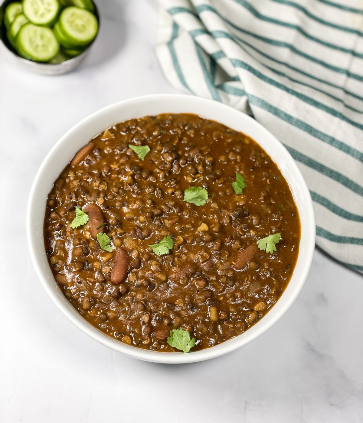 A bowl is full of Instant pot dal makhani.