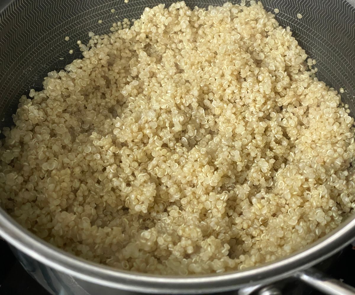 A pot has cooked quinoa.
