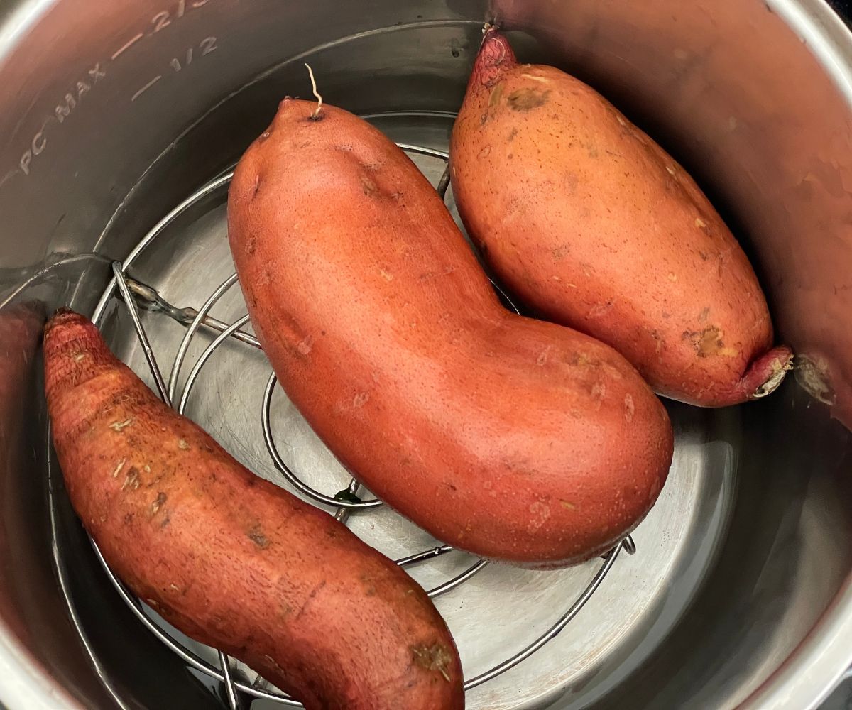 An instant pot has sweet potatoes.