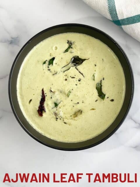 A bowl of ajwain leaf tambuli is on the surface.