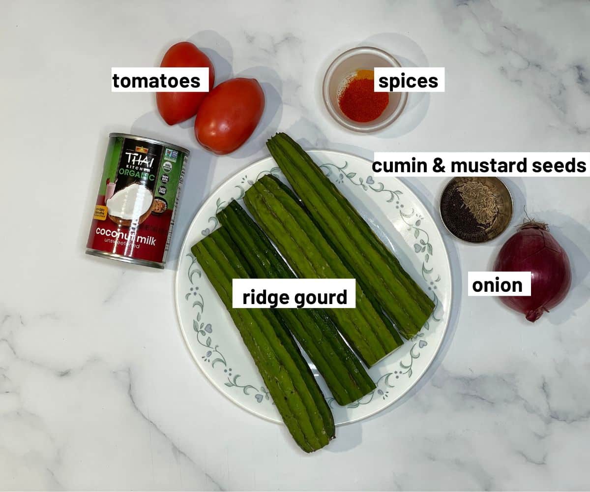 Ridge gourd curry ingredients are on the table.