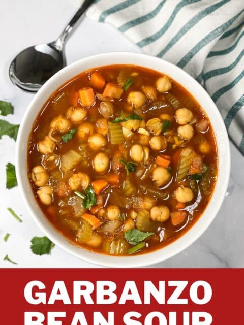 A bowl of garbanzo bean soup is on the table.