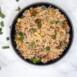 A bowl filled with vegetable basmati fried rice.