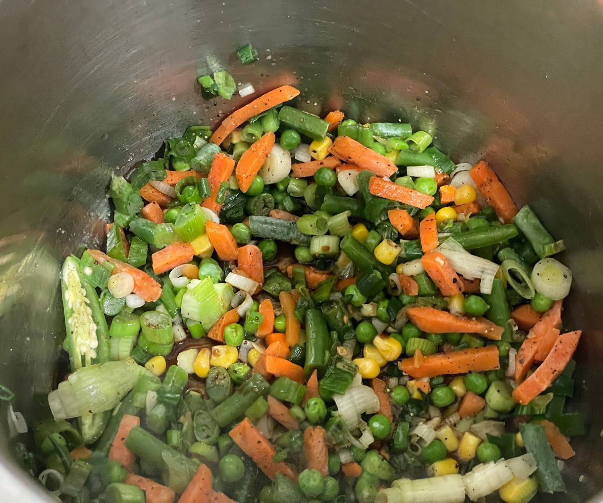 An instant pot has all the mixed vegetables.