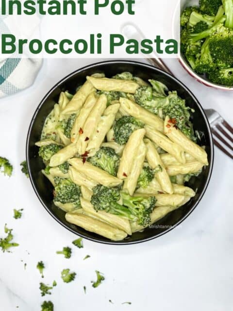 A bowl is full of vegan broccoli pasta.