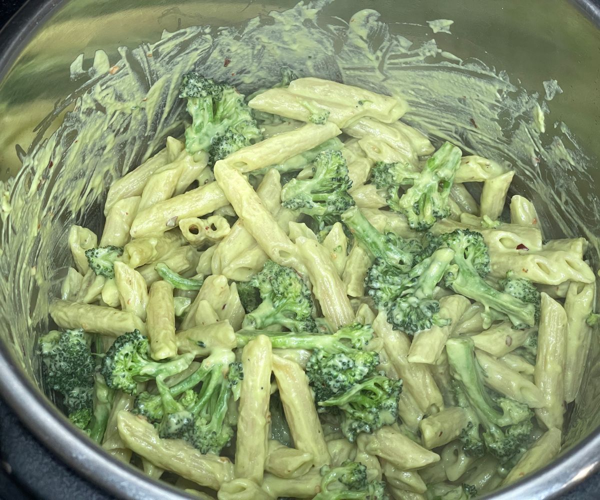 An Instant pot has filled with broccoli pasta.