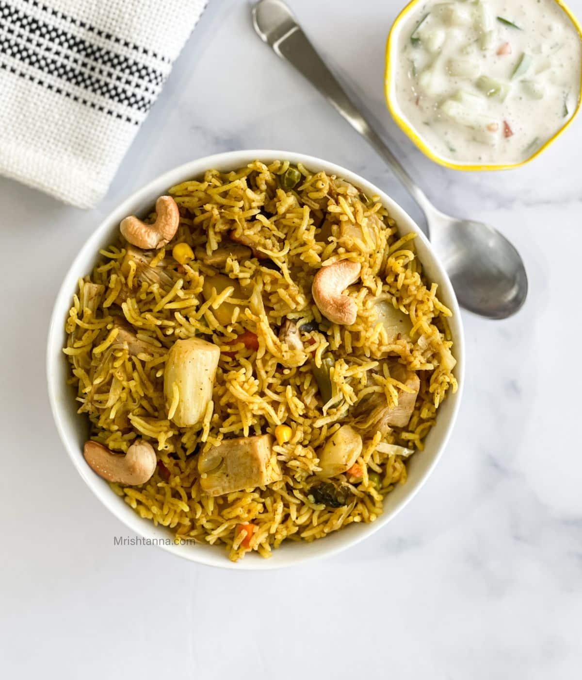 A bowl is full of Jackfruit Biryani.