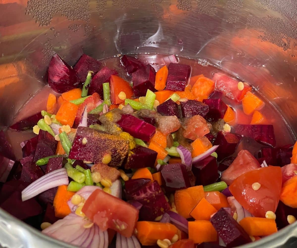 A pot is with chopped vegetables.