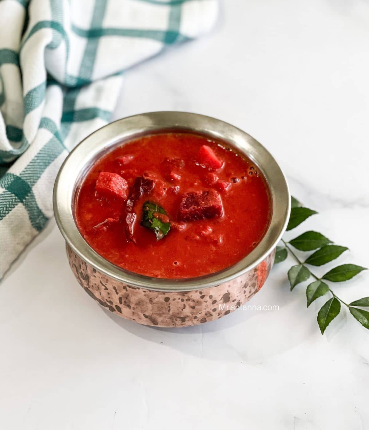 A bowl of Kerala Sambar is on the table.