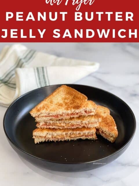 A plate of air fried peanut butter jelly sandwiches on the table.
