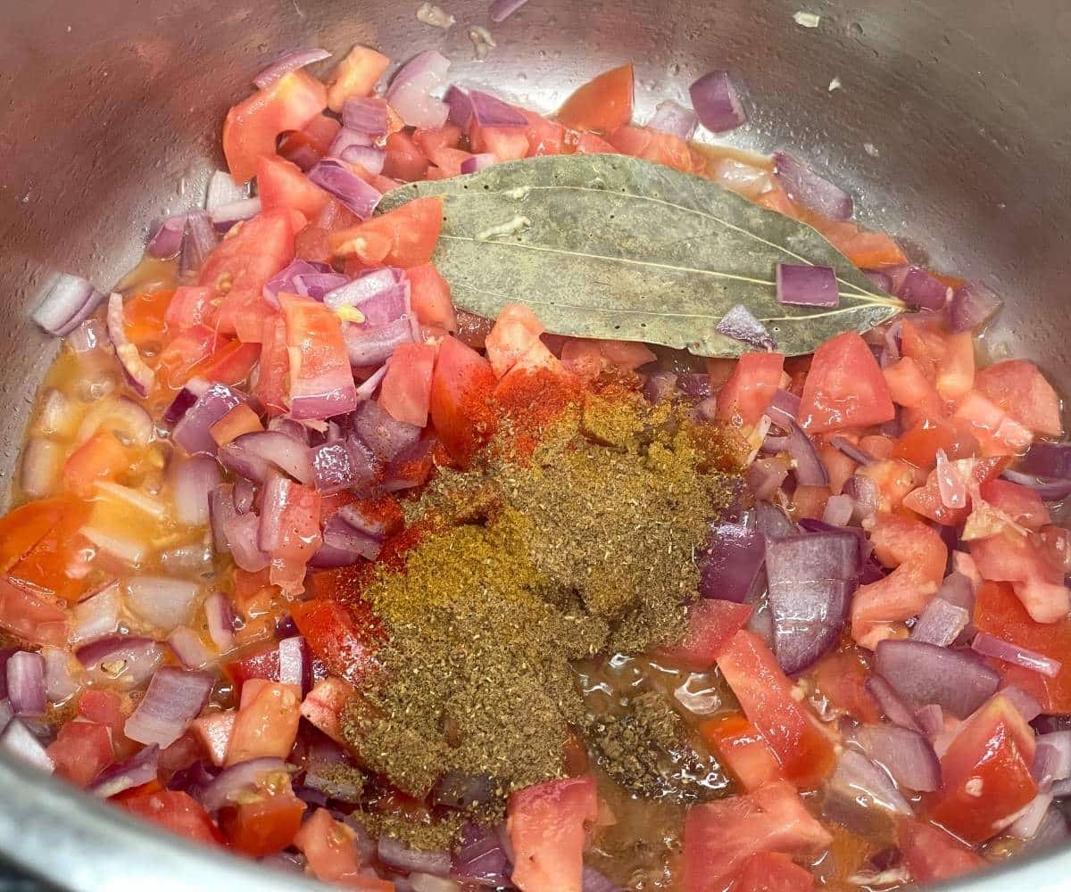 An instant pot has black eyed peas pulao ingredients.
