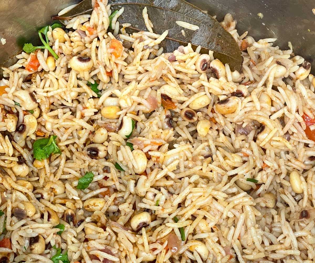 An instant pot has black eyed peas rice.