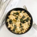 A bowl of kale rice is on the table.