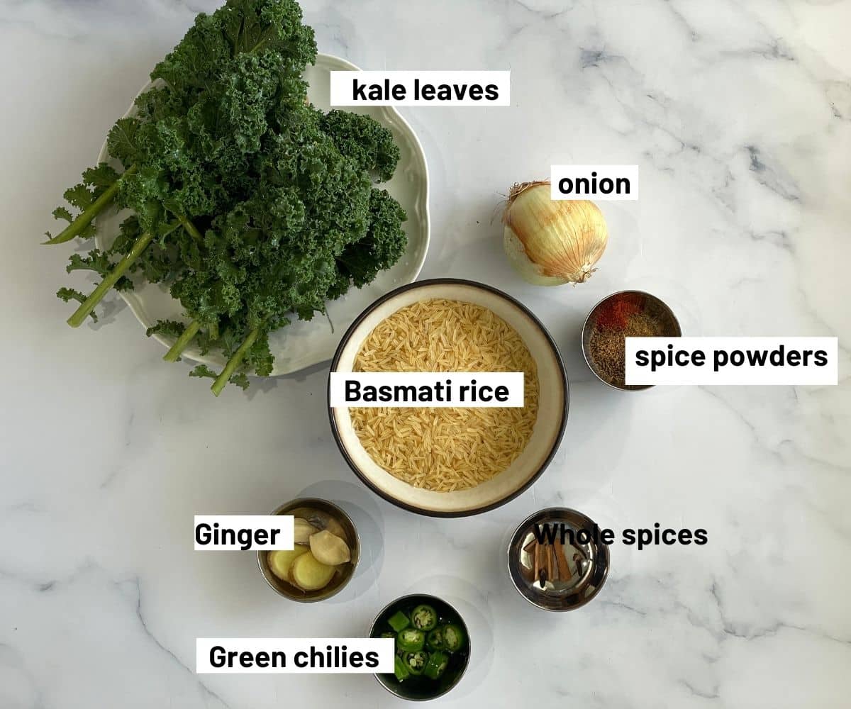 The table is covered with kale rice ingredients.