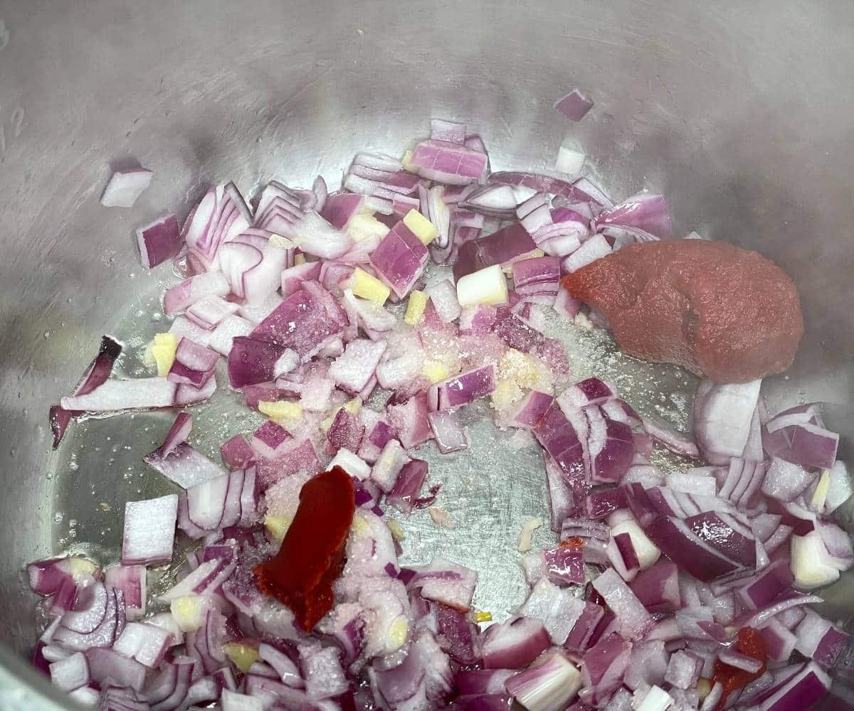 On instant pot has onions, tomato paste for lentil soup.