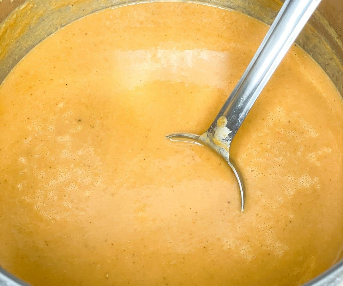 An instant pot is full of creamy lentil soup.