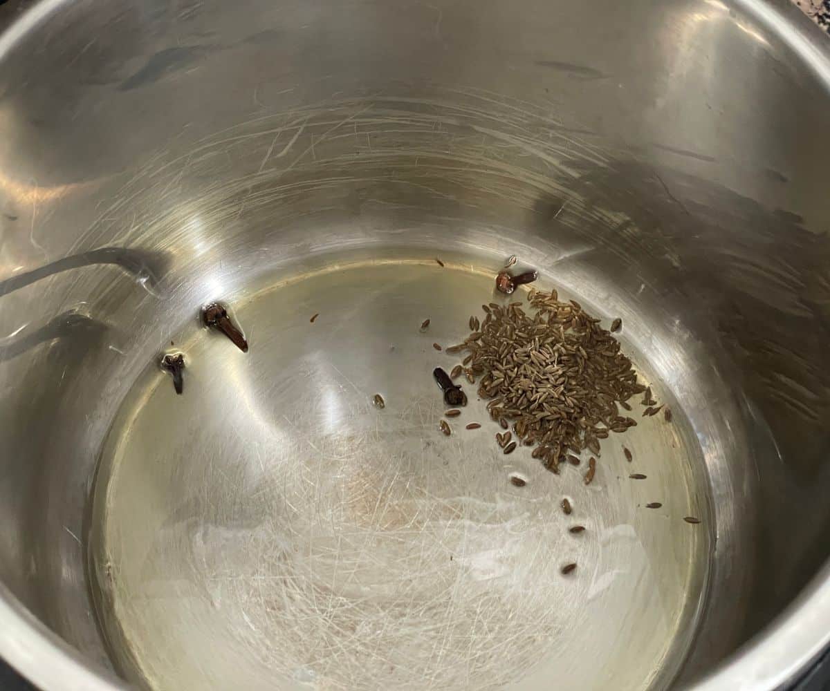 A pot is with oil and spices.