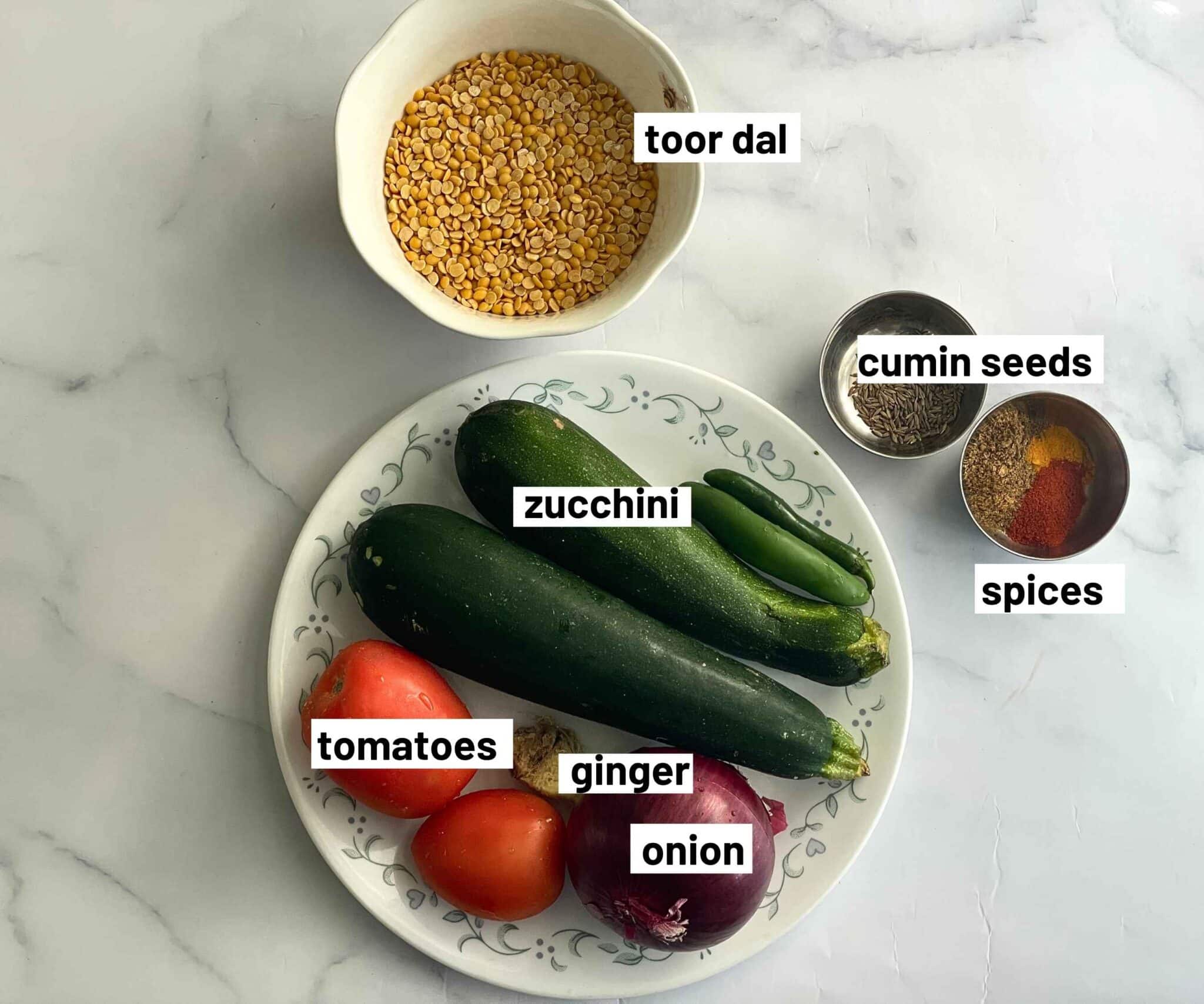 A table has zucchini dal recipe ingredients.