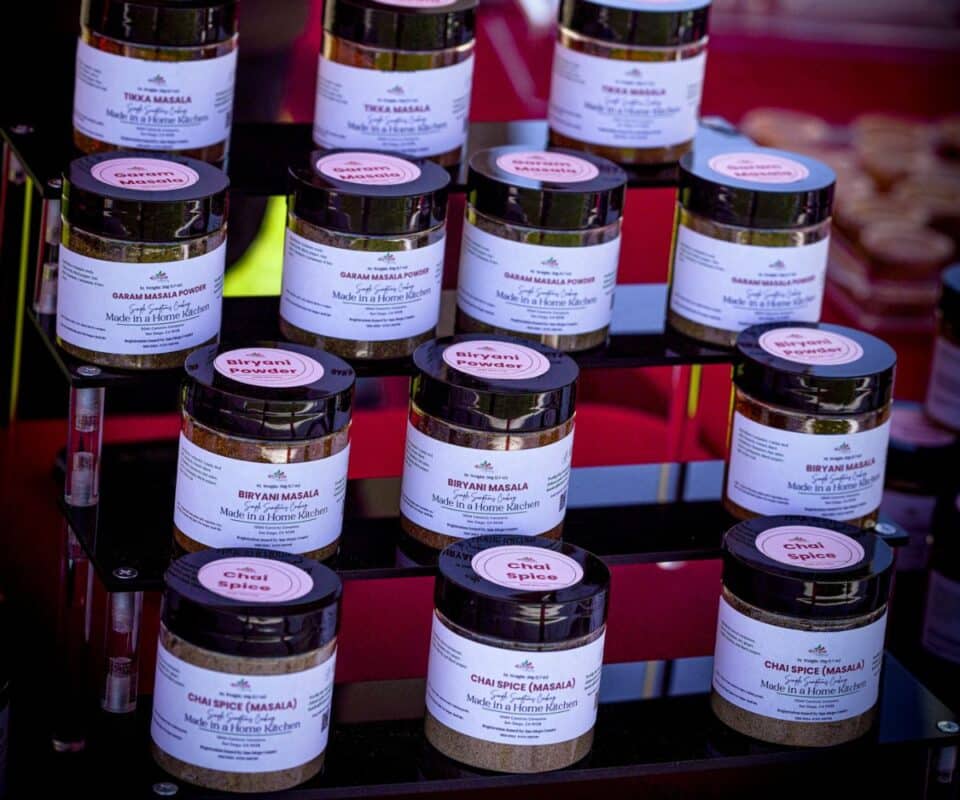Layers of spice jars on the stand.