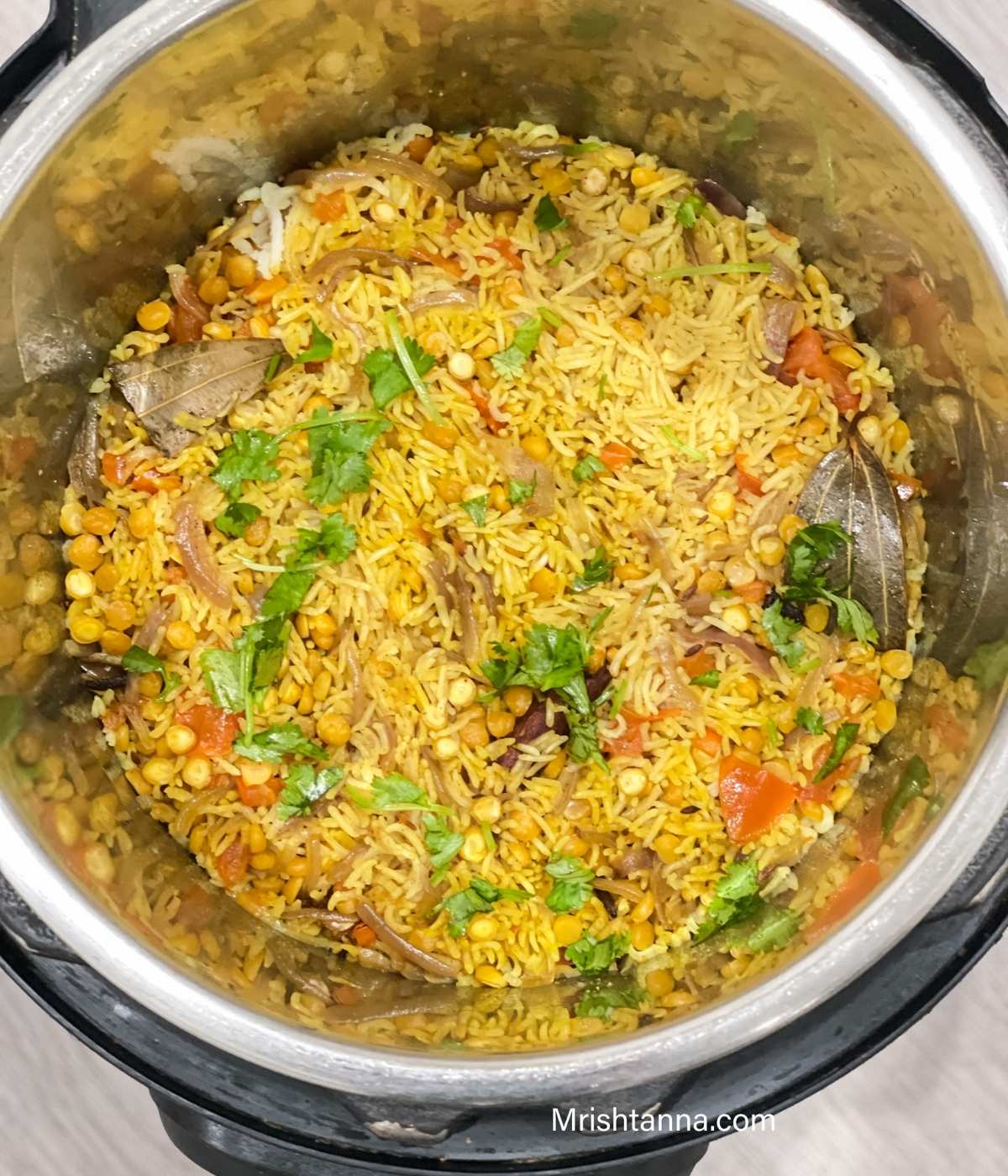 A pot is with Chana dal pulao.